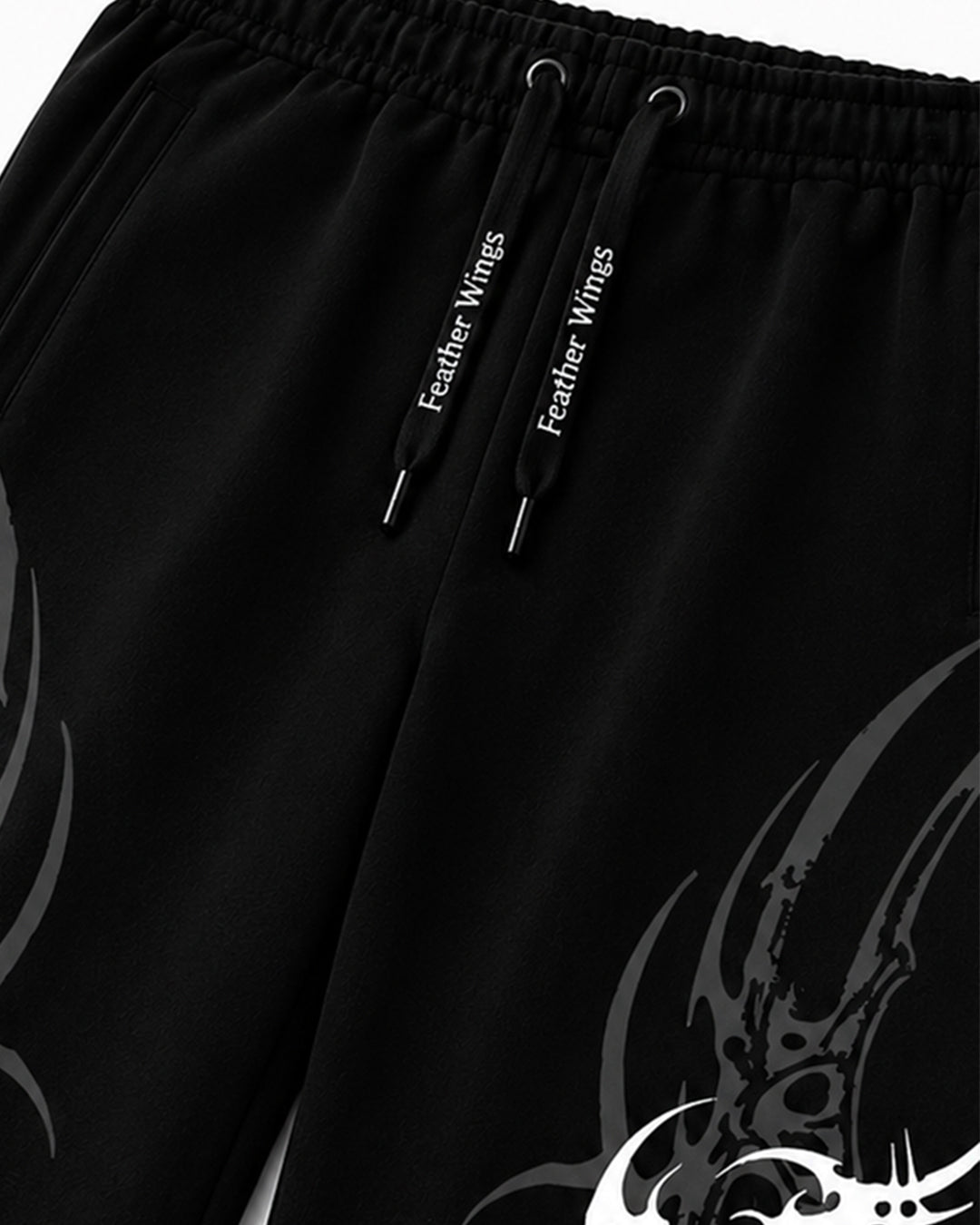 Black athletic sweatpants with a white 'Feather Wings' logo printed on the drawstrings and a large white graphic on the lower leg.